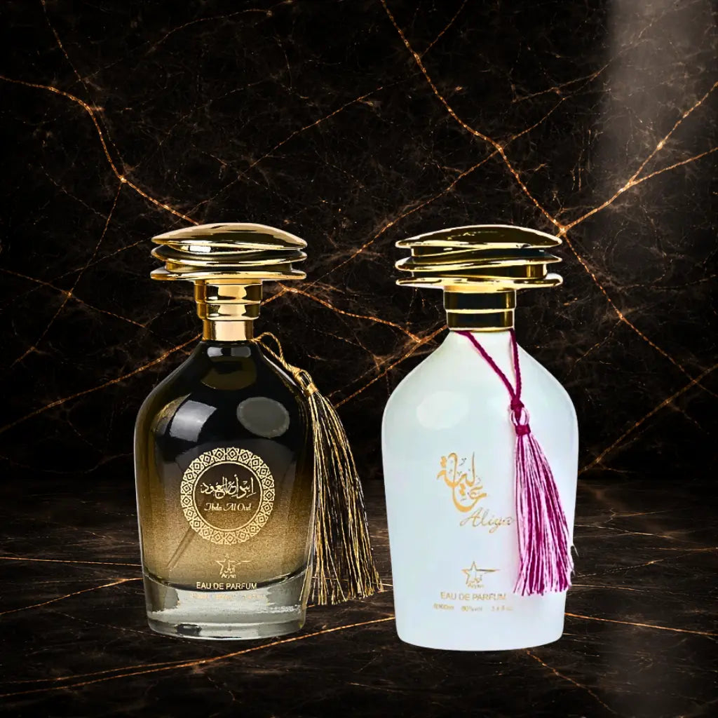 Set of two oriental perfumes for women and men by ZEIRA, featuring Aliya and Ibda Al Oud in elegant bottles.